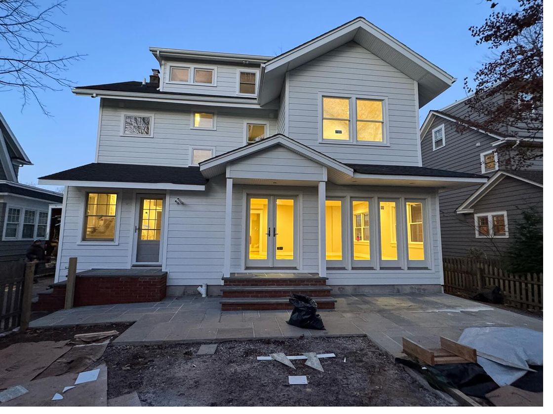 Home at dusk with new energy-efficient windows